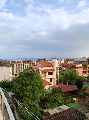 a view of a city with buildings and trees at Студио Слънчево утро in Burgas City