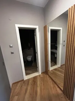 an empty room with a toilet and a mirror at Open Sea Panorama Residence in Obzor