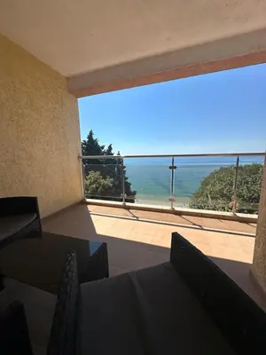 a view of the ocean from a room with a large window at Apartments in Panorama Beach Vigo Nessebar in Nesebar