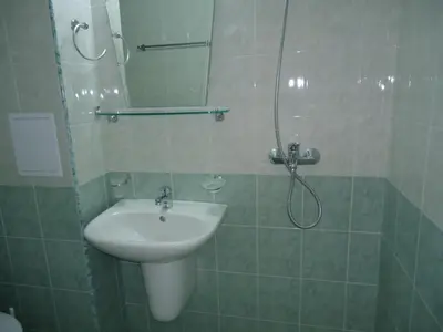 a bathroom with a sink and a shower at Pension RUSKOVI GuestHouse in Ravda