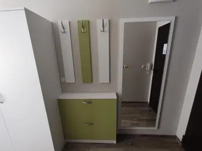 a bathroom with a green dresser and a mirror at Studio Sorrento Sole Mare-Bastet BS in Sveti Vlas