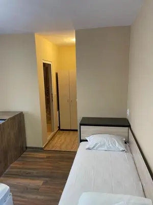 a bedroom with a large bed in a room at Family Hotel Malibu in Chernomorets