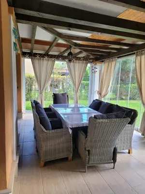a dining room with a table and chairs at Green Line Villa Sozopol in Sozopol