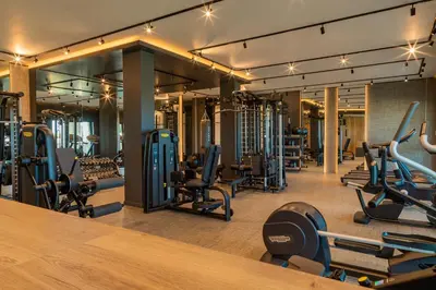 a gym with lots of treadmills and machines at Green Line Villa Sozopol in Sozopol