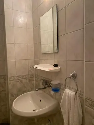 a bathroom with a sink and a mirror at Sozopol Apartment 3 in Sozopol