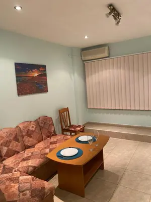 a living room with a couch and a table at Sozopol Apartment 3 in Sozopol