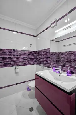 a bathroom with a purple sink and a toilet at 3BD Beach Paradise with a Stunning View with Parking by Flat Mаnаger in Nesebar