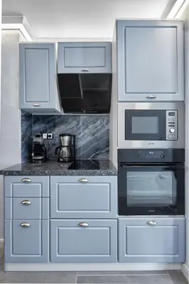a kitchen with a stove and a microwave at 3BD Beach Paradise with a Stunning View with Parking by Flat Mаnаger in Nesebar