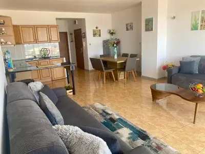 a living room with a couch and a table at Gorgeous, 1 Bed Apt, Sea Views. in Duni