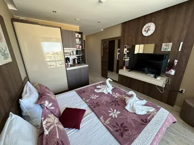 a bedroom with a bed with two dolls on it at Sea View Private Studio Paradiso B 509 in Nesebar