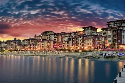 a group of buildings next to a body of water at Garden of Eden - Apartament Niya in Sveti Vlas