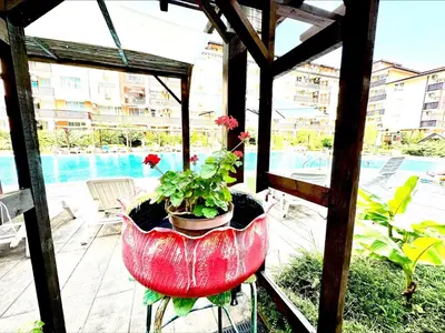 a planter with a plant in it on a patio at Chateau Aheloy 2 - Menada Apartments in Aheloy