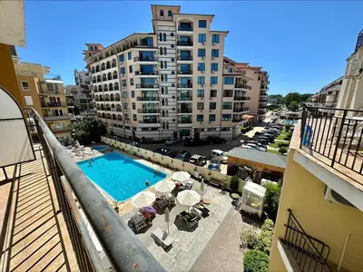 a view of a pool from a balcony of a building at Blue Marine - Menada Apartments in Sunny Beach