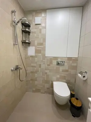 a small bathroom with a toilet and a shower at Studio Green Зелено Студио in Burgas City