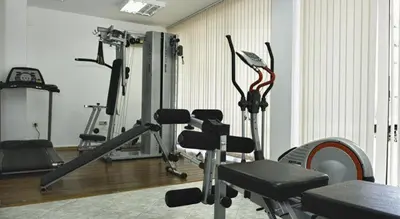 a gym with several exercise bikes in a room at Royal Sun Complex in Sunny Beach