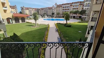 a balcony with a view of a pool and buildings at Royal Sun Complex in Sunny Beach