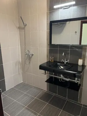 a bathroom with a sink and a mirror at Sea View 2BR Apartment Sozopol in Sozopol