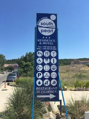 a sign for a south pearl restaurant and hotel at Bułgaria na lato apartament z widokiem na morze Sozopol in Sozopol