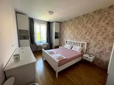 a small bedroom with a bed and a desk at Sea Vibes - Modern Apartment Near the Beach & City Center, Burgas in Burgas City