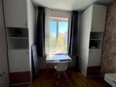 a small room with a desk and a window at Sea Vibes - Modern Apartment Near the Beach & City Center, Burgas in Burgas City