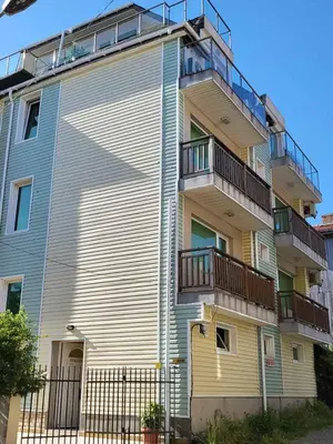 a tall building with balconies on the side of it at Penthouse Apartments PERLA, Vasiliko in Tsarevo