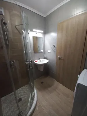 a bathroom with a shower and a sink at Cascadas Family Resort in Sunny Beach