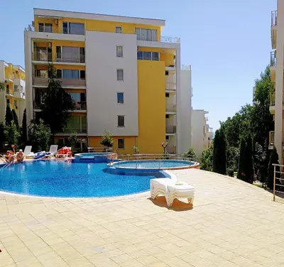 a large swimming pool in front of a building at Apartament Sea Fort Club Grand Resort Fort Noks Sveti Vlas-Bastet BS in Elenite