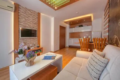 a living room with a couch and a table at Sweet Homes 2 Holiday Apartment in Sunny Beach