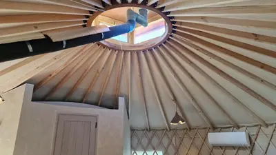 a ceiling of a yurt with a round window at Gala park fpv in Avren