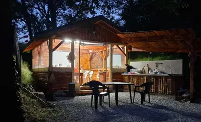 a small house with a table and chairs in front of it at Gala park fpv in Avren