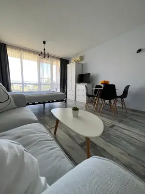 a living room with a couch and a table at Studio E32 Atia Resort Chernomoretz in Chernomorets