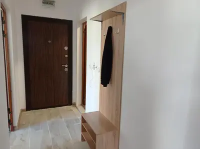 a hallway with a door and a wooden door at Екзарх Йосиф in Tsarevo