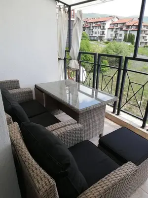 a table and chairs on a balcony with a view at Ferienwohnung mit Meerblick! in Sveti Vlas