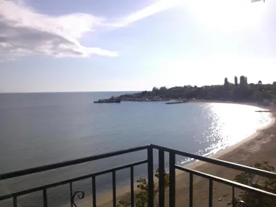 a view of a beach from a balcony at Villa Lazuren Bryag 2 in Chernomorets