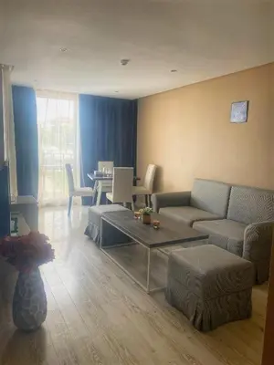 a living room with a couch and a table at Sea View Apartment In PARADISO in Nesebar