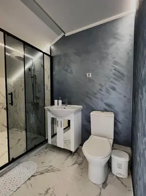 a bathroom with a toilet and a sink at Seagull Studio Byala in Byala