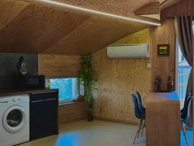 a laundry room with a washing machine and a window at Seagull Studio Byala in Byala