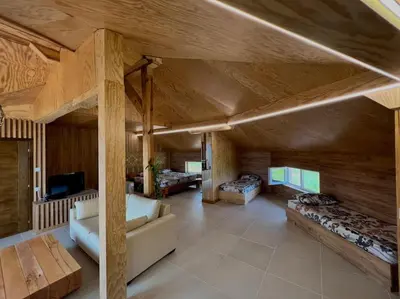 a large room with two beds and a couch at Seagull Studio Byala in Byala