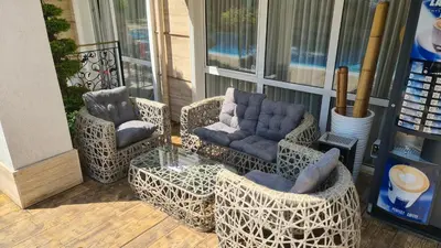 a group of chairs and chairs on a porch at Sweet Home 2 Apartment in Sunny Beach