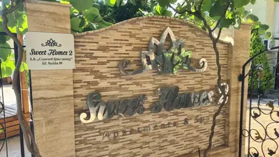 a sign for a store with a cactus on it at Sweet Home 2 Apartment in Sunny Beach