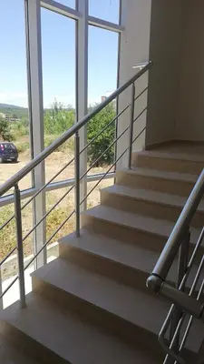 a set of stairs in a building with windows at ARIA in Primorsko
