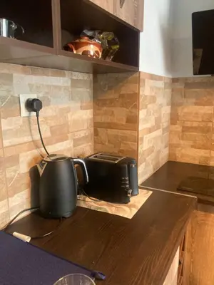 a kitchen counter with a toaster on top of it at Desis Seaside Hideaway in Pomorie