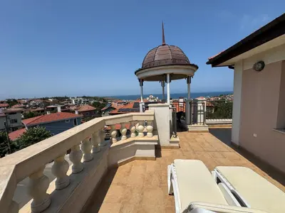a balcony with a gazebo on top of a building at Luxury Apartments Ekaterina in Chernomorets