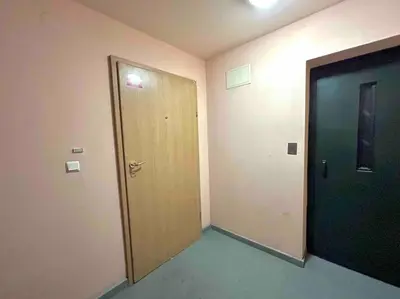 an empty room with a door and a hallway with a door at By The Sea Apartment in Varna City