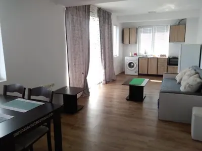 a living room with a couch and a table at Апартаменты за гости Гаван in Byala