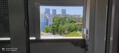 a window in a room with a view of a city at Apartment Krisiya in Burgas in Burgas City