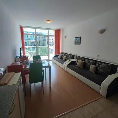 a living room with two couches and a table at Sunny Holiday - Cacao Beach Apartments in Sunny Beach
