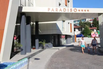 two women and a child walking in front of a building at PARADISO 'В' 201 One Bedroom Apartment in Nesebar