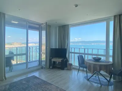 a living room with a view of the ocean at PARADISO 'В' 207 Two Bedroom Apartment in Nesebar