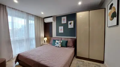 a bedroom with a bed and a large window at PARADISO 'В' 607 Large Luxury Apartment in Nesebar